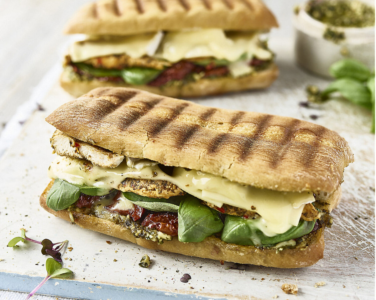 Toasted Ciabatta with Chicken, Cheese, Pesto, Sun-dried Tomatoes and Basil
