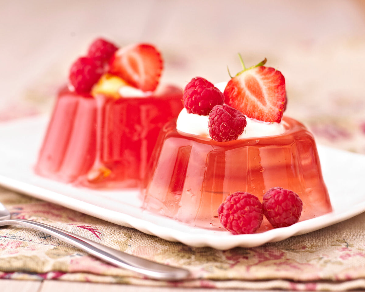 strawberry jelly topped with strawberry and raspberry after jelly making