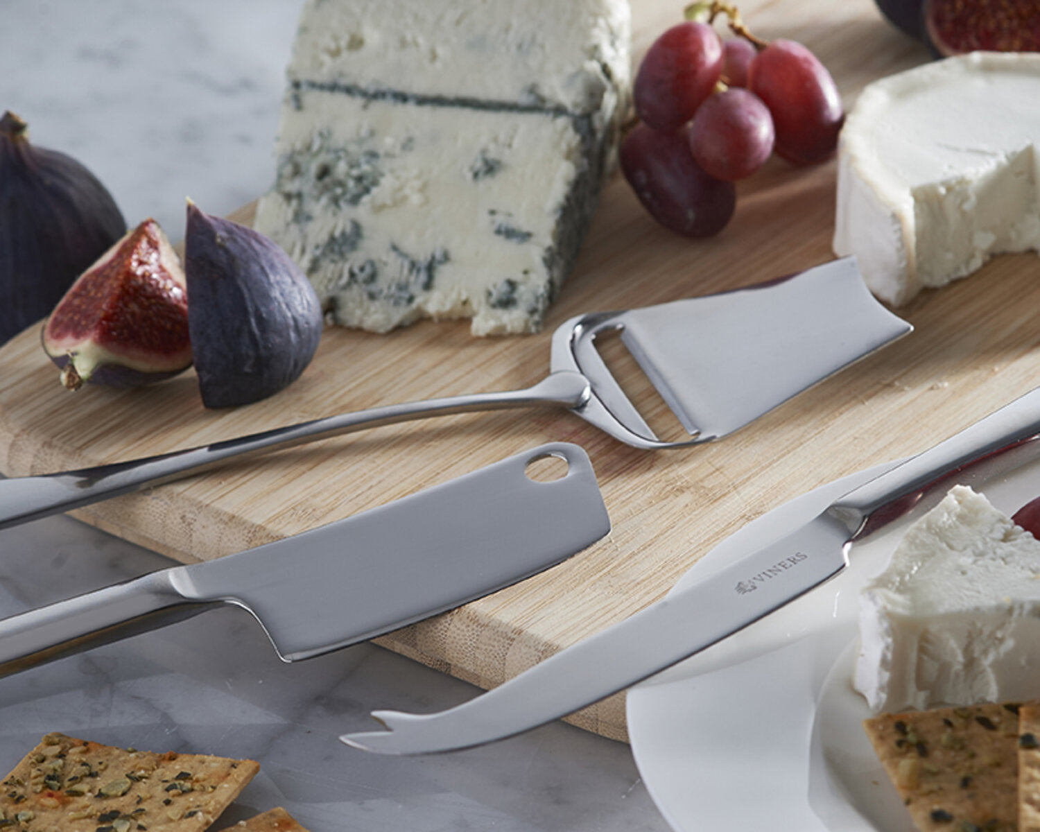 cheese and grapes on a cheeseboard for cheese and wine night