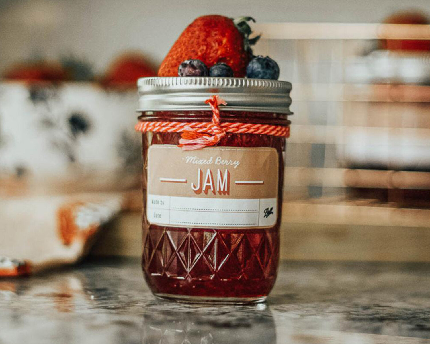 jam in a jar on kitchen worktop after jam making