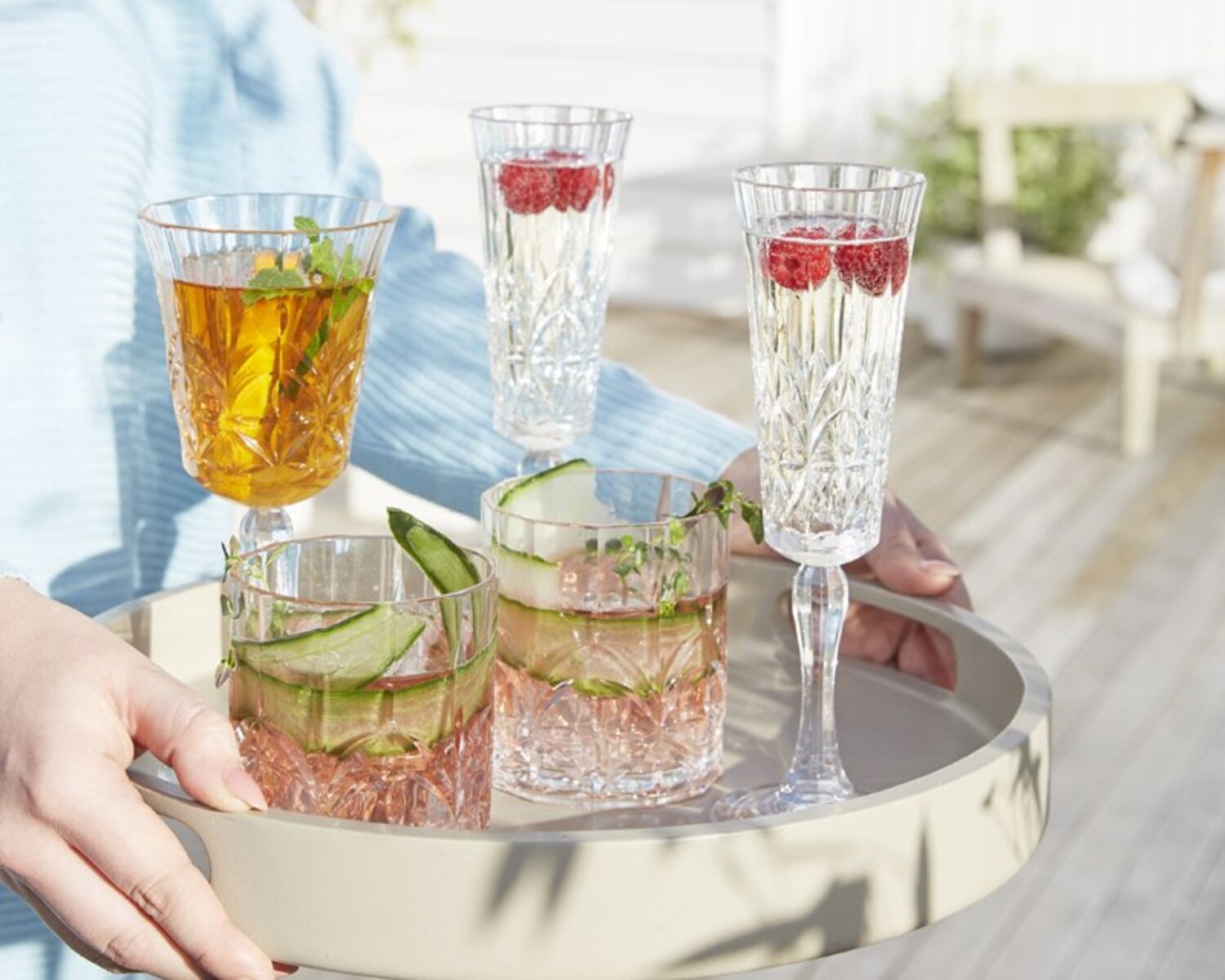 mocktails inside acrylic glassware on serving board