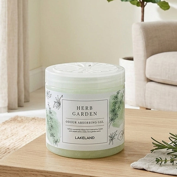 A Herb Garden scented candle on a coffee table