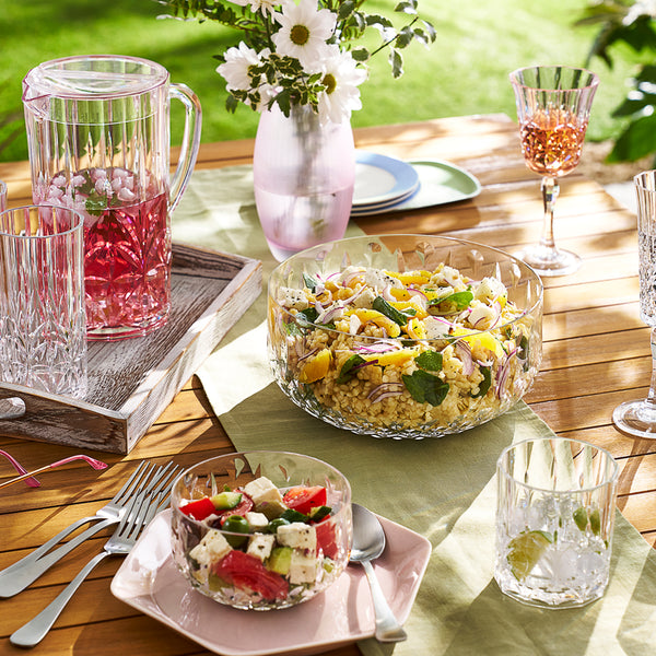 Tableware arranged for outdoor entertaining.