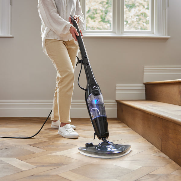 Lakeland Duo Steam Mop cleaning a hardwood floor.
