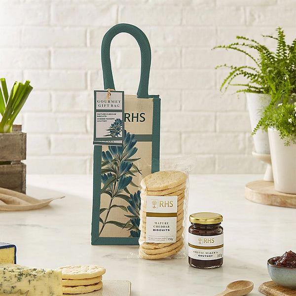 A small gift tote containing novelty jam and biscuits.