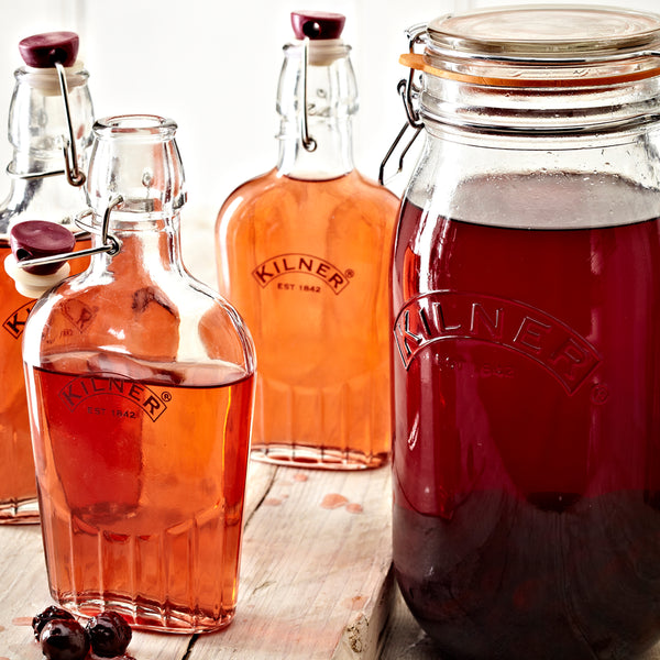 A collection of Kilner bottles with home-made liquids.