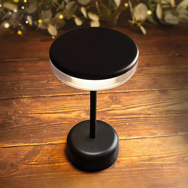 A Lakeland rechargable table lamp on a wooden surface.